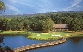view of community with a water view and a wooded view