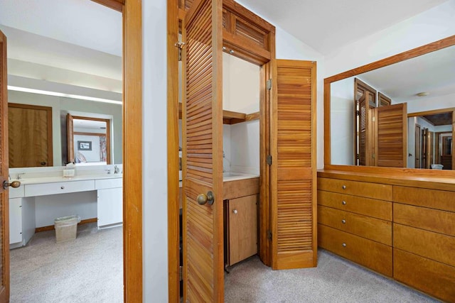 interior space featuring a sink and carpet floors