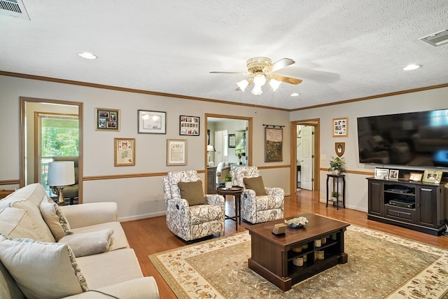 8500 Jackson Rd, Midland, GA 31820 - living room featuring wood finished floors, ceiling fan, recessed lighting, and ornamental molding