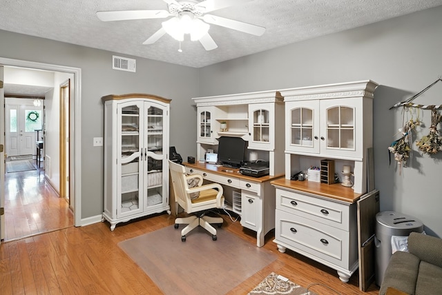 8500 Jackson Rd, Midland, GA 31820 - office with a ceiling fan, light wood-style flooring, a textured ceiling, and built in desk