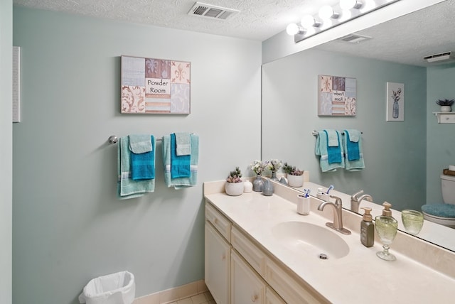 8500 Jackson Rd, Midland, GA 31820 - bathroom with a textured ceiling, vanity, and tile patterned floors