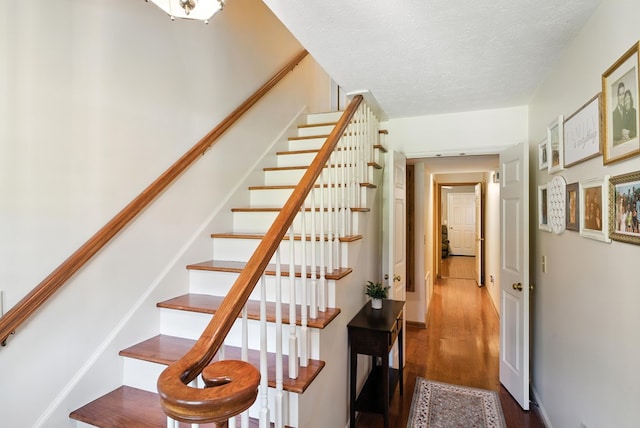 8500 Jackson Rd, Midland, GA 31820 - staircase with wood finished floors and a textured ceiling