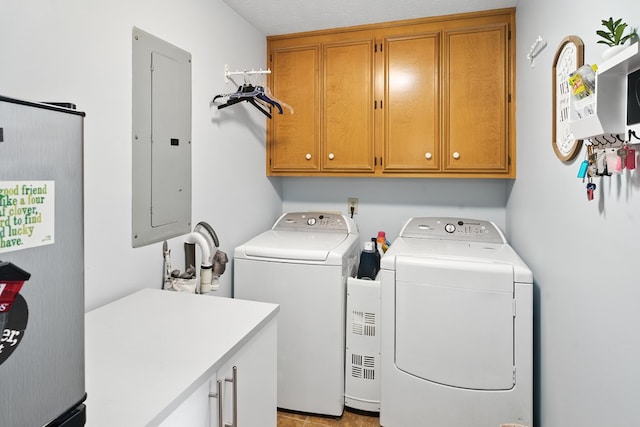 8500 Jackson Rd, Midland, GA 31820 - washroom with cabinet space, electric panel, and washer and clothes dryer