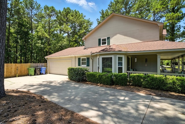 8500 Jackson Rd, Midland, GA 31820 - view of front of home with driveway, an attached garage, covered porch, and roof with shingles