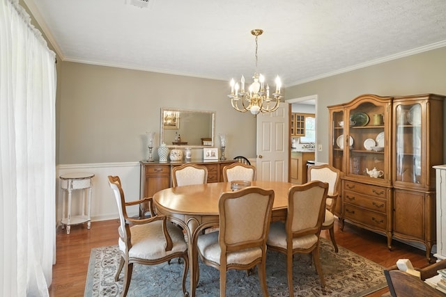 8500 Jackson Rd, Midland, GA 31820 - dining area featuring a chandelier, wood finished floors, and crown molding