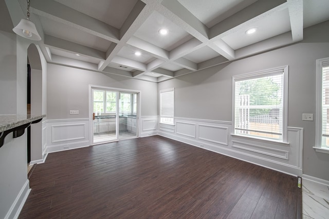 7312 Sorrel Ct, Columbus, GA 31909 - unfurnished living room featuring beam ceiling, coffered ceiling, dark wood-type flooring, arched walkways, and recessed lighting