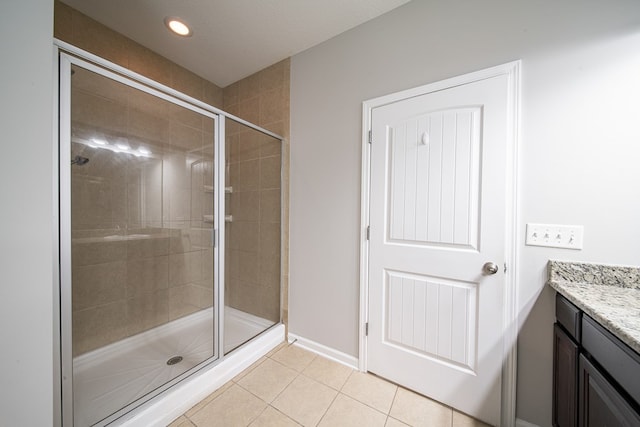 7312 Sorrel Ct, Columbus, GA 31909 - bathroom with a stall shower, tile patterned floors, vanity, and recessed lighting