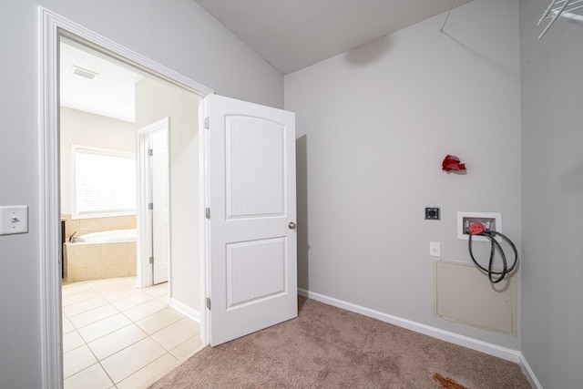 7312 Sorrel Ct, Columbus, GA 31909 - laundry area featuring hookup for a washing machine, light tile patterned floors, baseboards, electric dryer hookup, and light colored carpet