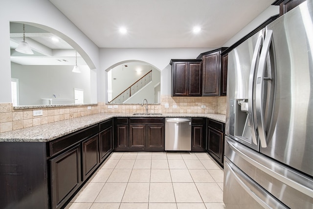 7312 Sorrel Ct, Columbus, GA 31909 - kitchen with appliances with stainless steel finishes, a sink, light stone countertops, decorative backsplash, and recessed lighting