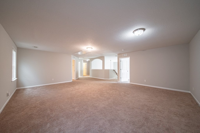 7312 Sorrel Ct, Columbus, GA 31909 - spare room featuring attic access, carpet flooring, a textured ceiling, and baseboards