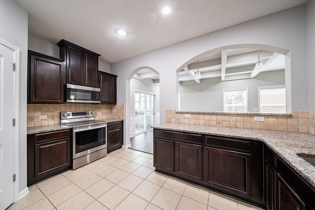 7312 Sorrel Ct, Columbus, GA 31909 - kitchen featuring appliances with stainless steel finishes, light tile patterned floors, coffered ceiling, tasteful backsplash, and recessed lighting