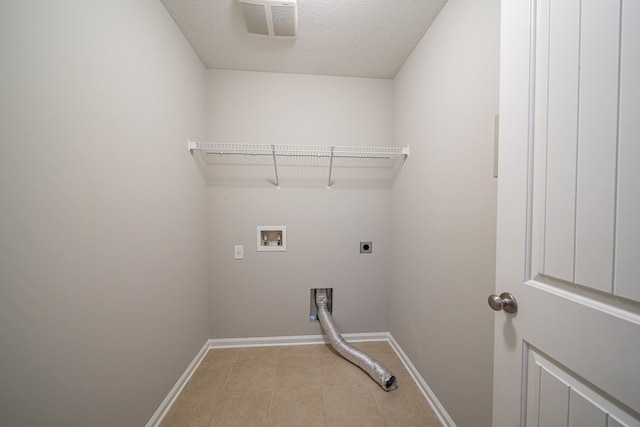 7312 Sorrel Ct, Columbus, GA 31909 - clothes washing area with hookup for an electric dryer, baseboards, hookup for a washing machine, and light tile patterned flooring