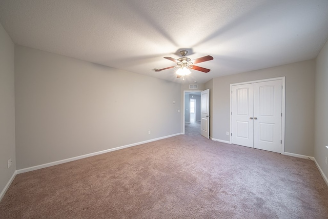 7312 Sorrel Ct, Columbus, GA 31909 - unfurnished bedroom featuring carpet flooring, baseboards, a closet, a ceiling fan, and a textured ceiling