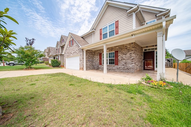 7312 Sorrel Ct, Columbus, GA 31909 - traditional-style house with a garage, concrete driveway, brick siding, and covered porch