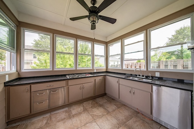 7312 Sorrel Ct, Columbus, GA 31909 - kitchen with a sink, dark countertops, dishwasher, a ceiling fan, and stainless steel gas stovetop