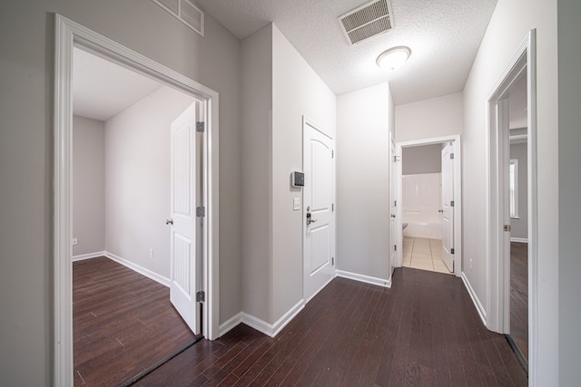 7312 Sorrel Ct, Columbus, GA 31909 - hallway featuring hardwood / wood-style floors, baseboards, and a textured ceiling