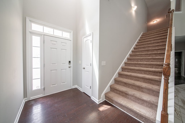 7312 Sorrel Ct, Columbus, GA 31909 - entryway with stairway, dark wood-type flooring, baseboards, and a high ceiling