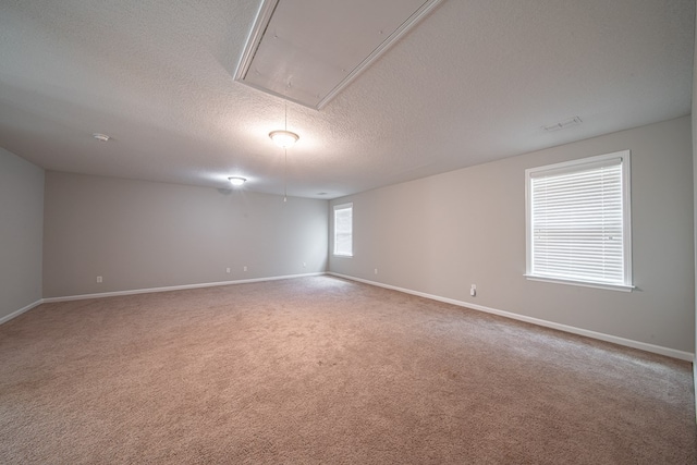 7312 Sorrel Ct, Columbus, GA 31909 - unfurnished room featuring attic access, a textured ceiling, carpet floors, and baseboards