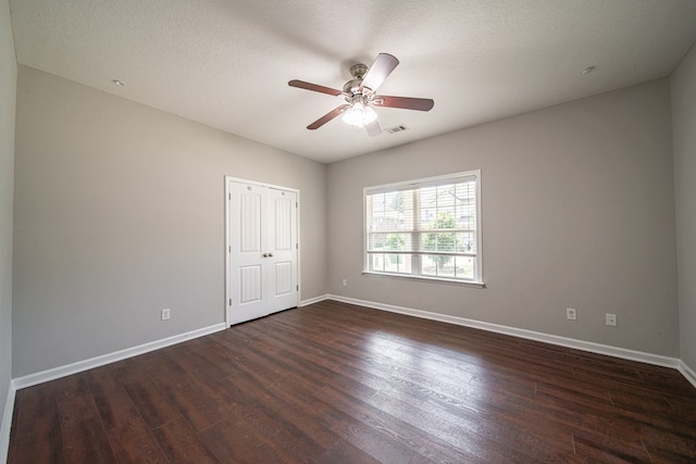 7312 Sorrel Ct, Columbus, GA 31909 - unfurnished bedroom with dark wood-style flooring, baseboards, ceiling fan, and a closet