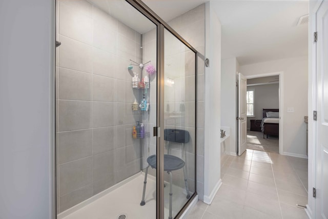 bathroom with tile patterned floors and walk in shower