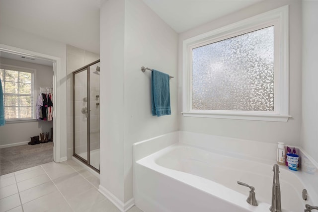 bathroom with tile patterned floors and plus walk in shower