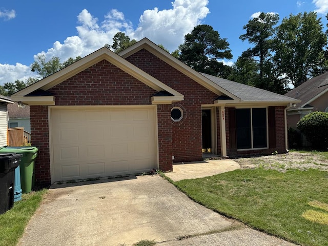 ranch-style home with a garage and a front yard