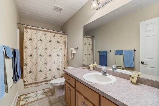 full bathroom with shower / bath combo with shower curtain, vanity, a textured ceiling, and toilet