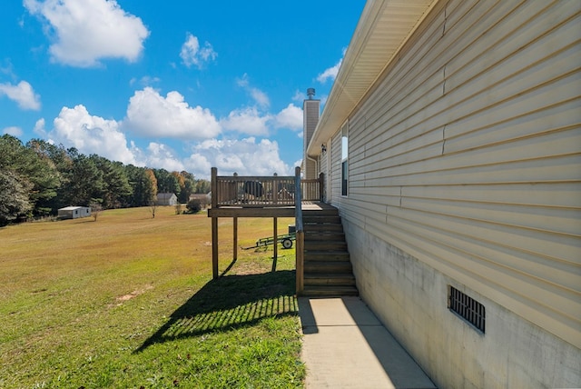 view of yard with a wooden deck