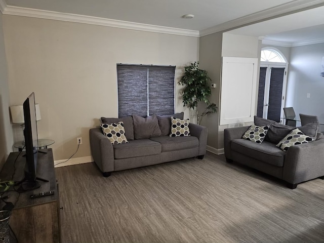 living room with crown molding and light hardwood / wood-style flooring