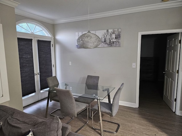 dining space featuring dark hardwood / wood-style floors and ornamental molding