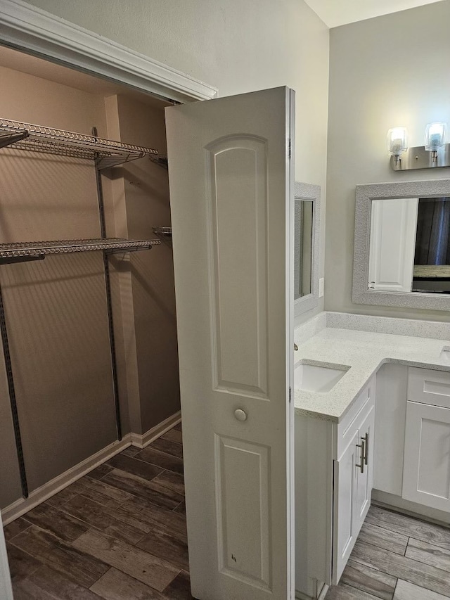 bathroom featuring vanity and hardwood / wood-style flooring