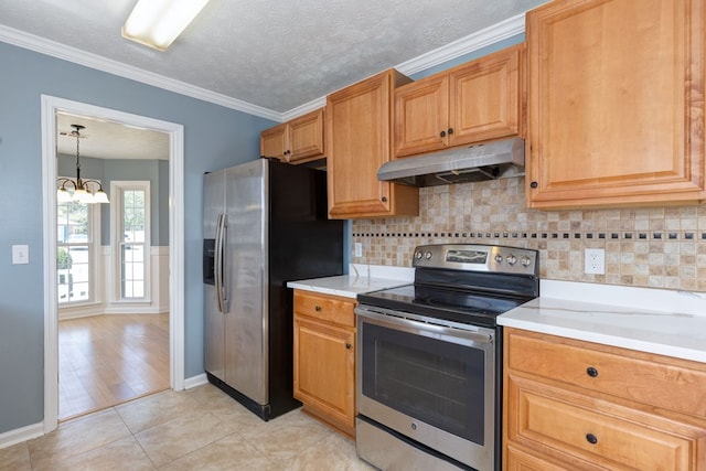 kitchen featuring an inviting chandelier, appliances with stainless steel finishes, under cabinet range hood, and light countertops