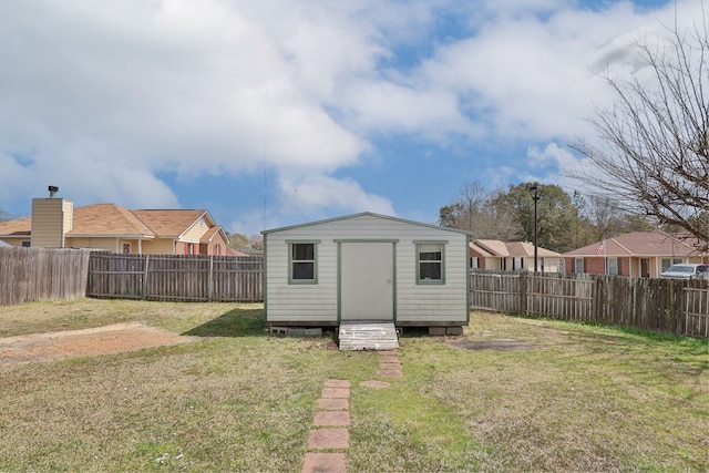 view of shed featuring a fenced backyard