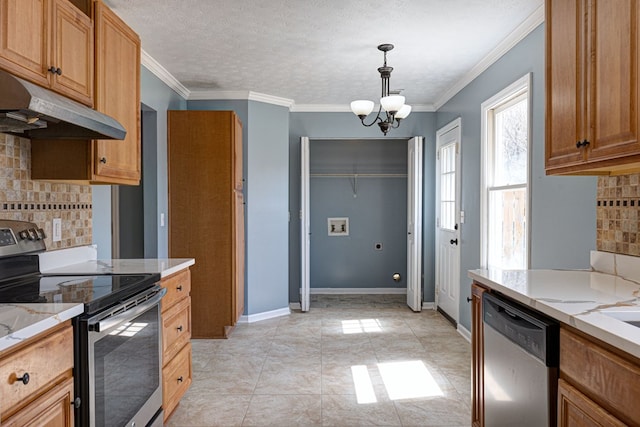 kitchen featuring light stone countertops, baseboards, stainless steel appliances, under cabinet range hood, and a chandelier