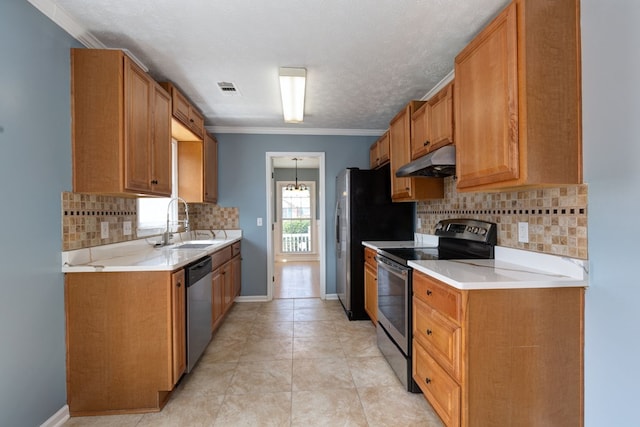 kitchen with visible vents, crown molding, under cabinet range hood, stainless steel appliances, and a sink