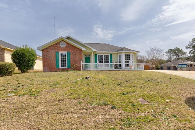 single story home with a front yard and brick siding