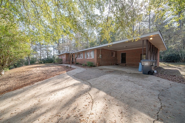 rear view of house featuring a carport