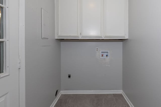 6727 Trapper Way, Midland, GA 31820 - laundry area with washer hookup, electric dryer hookup, and cabinet space