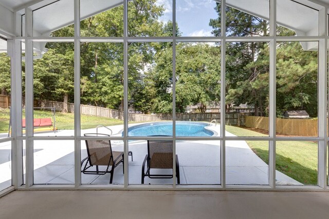 6727 Trapper Way, Midland, GA 31820 - entryway featuring finished concrete flooring, lofted ceiling, and view of scattered trees
