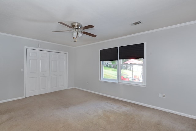 6727 Trapper Way, Midland, GA 31820 - unfurnished bedroom featuring carpet, ornamental molding, a closet, and ceiling fan