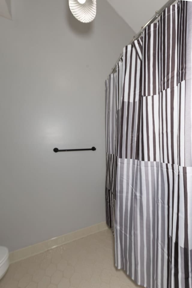 6727 Trapper Way, Midland, GA 31820 - bathroom with a shower with shower curtain and tile patterned flooring