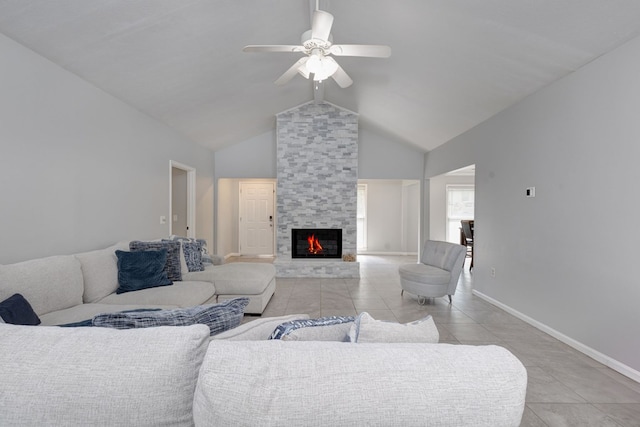 6727 Trapper Way, Midland, GA 31820 - living room with light tile patterned flooring, ceiling fan, a fireplace, and high vaulted ceiling