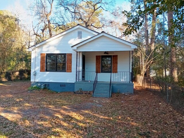 view of front of property with covered porch and a front yard