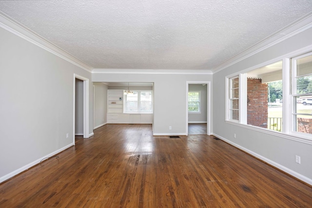 3824 Forrest Rd, Columbus, GA 31907 - spare room featuring a textured ceiling, dark wood finished floors, and crown molding