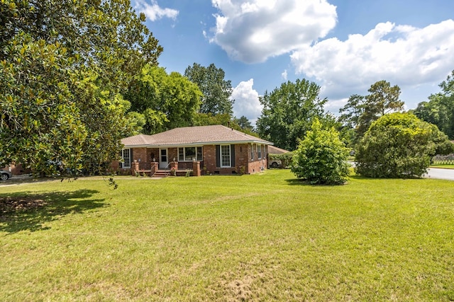 3824 Forrest Rd, Columbus, GA 31907 - view of front facade featuring brick siding and a front lawn