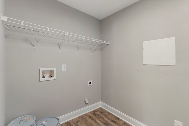 laundry room featuring hookup for an electric dryer, hardwood / wood-style floors, hookup for a gas dryer, and washer hookup