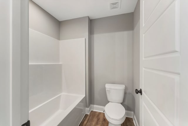 bathroom featuring wood-type flooring and toilet