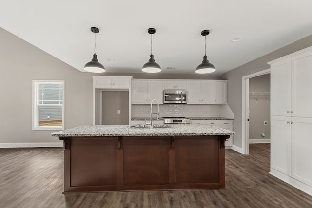 kitchen featuring dark hardwood / wood-style floors, white cabinetry, and sink