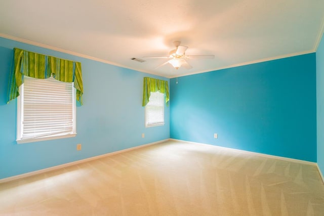 spare room with carpet flooring, ceiling fan, and ornamental molding