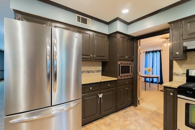 kitchen featuring backsplash, light stone counters, ornamental molding, and appliances with stainless steel finishes